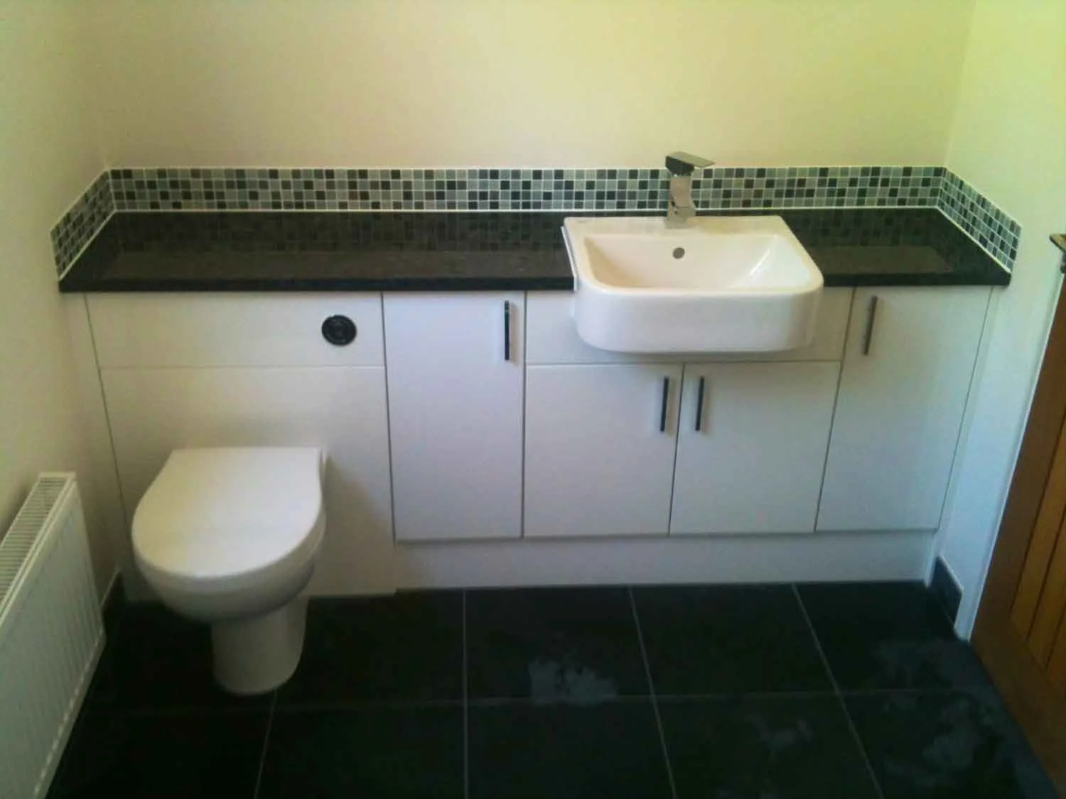 Bathroom basin, cupboards and fitted WC